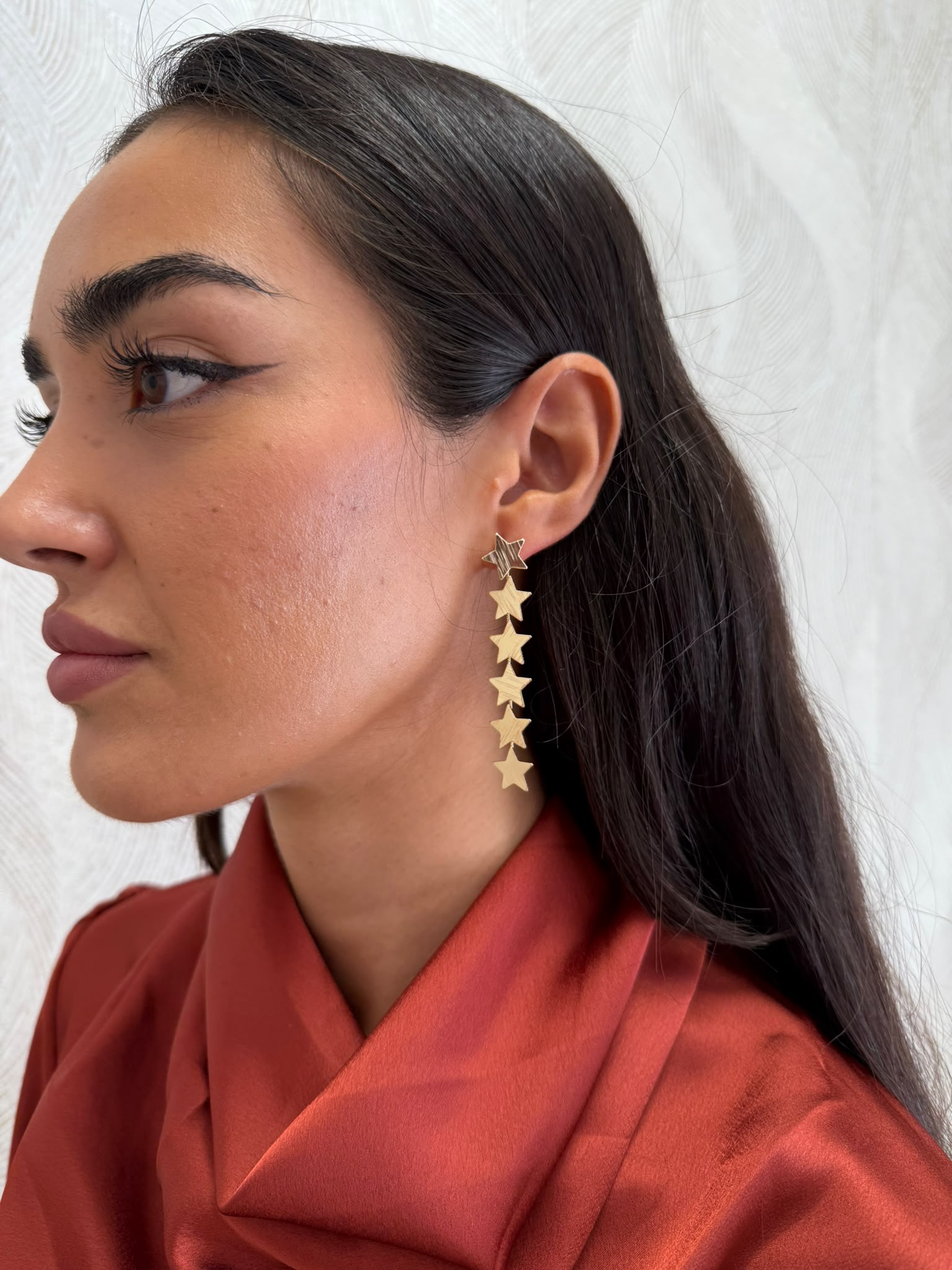 Pendientes largos dorados estrellas